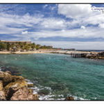 Die Bucht und der Strand vom Tauchplatz Marie Pompoean aus dem Tauchreiseführer